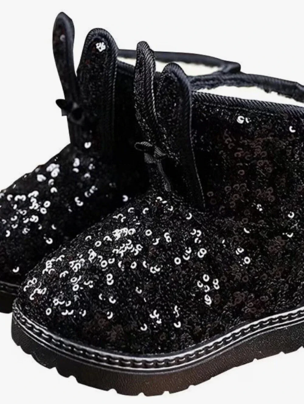 black sequin children's ankle boots with decorative bows and flat fur sole